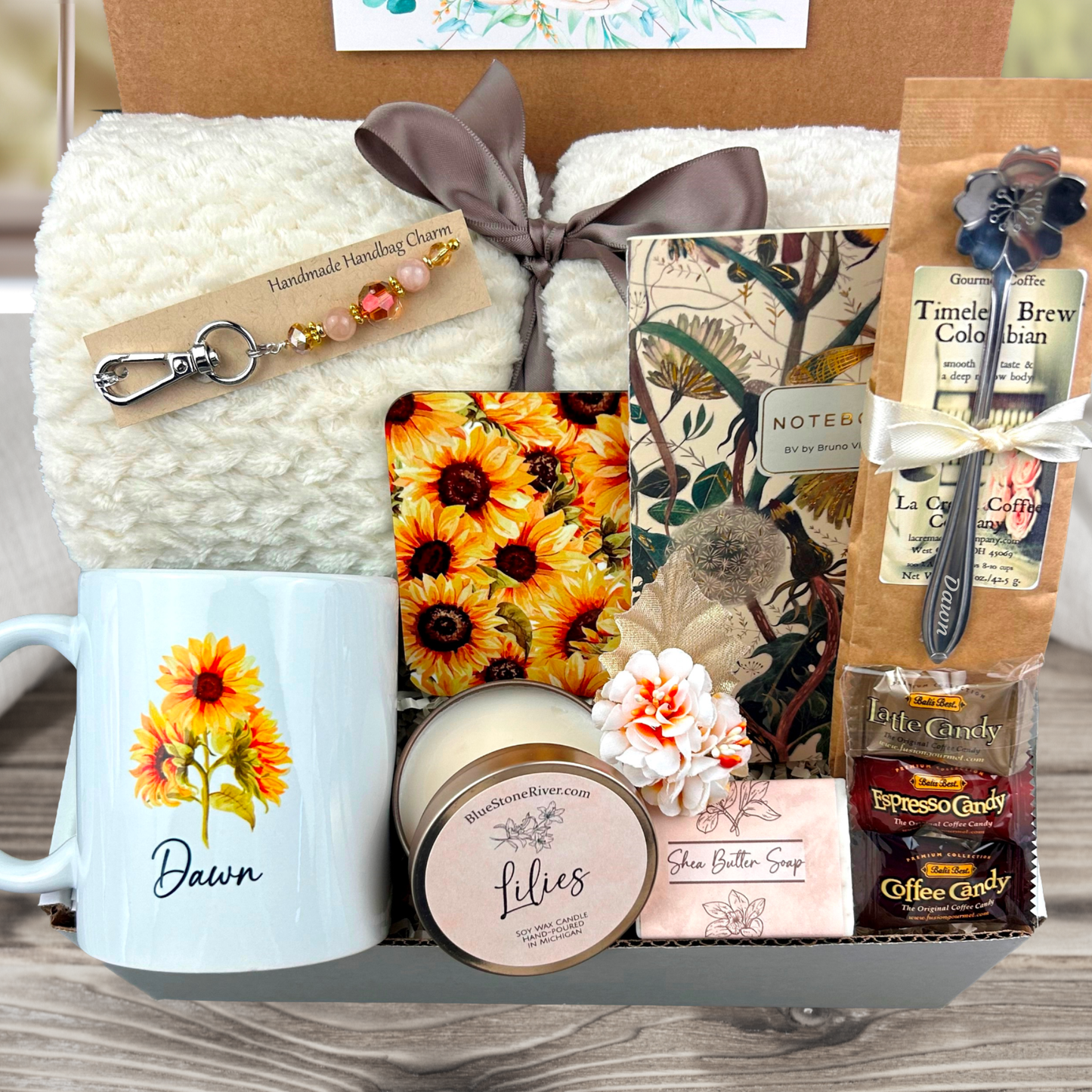 Retirement Gift Box with Blanket, personalized mug, engraved spoon, purse charm, coffee, candy, candle, notebook, soap and coaster in a sunflower design